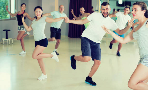 istock People dancing lindy hop in pairs 824187414