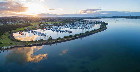 Aerial view of beautiful Westernport Marina with moored boats and yachts at sunset