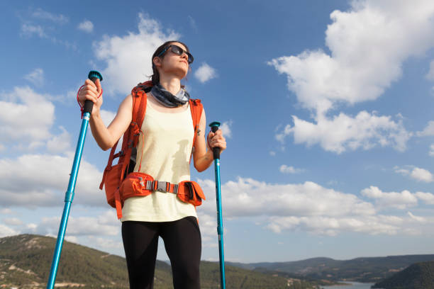 istock Female hiker climbing to mountain peak 824197006
