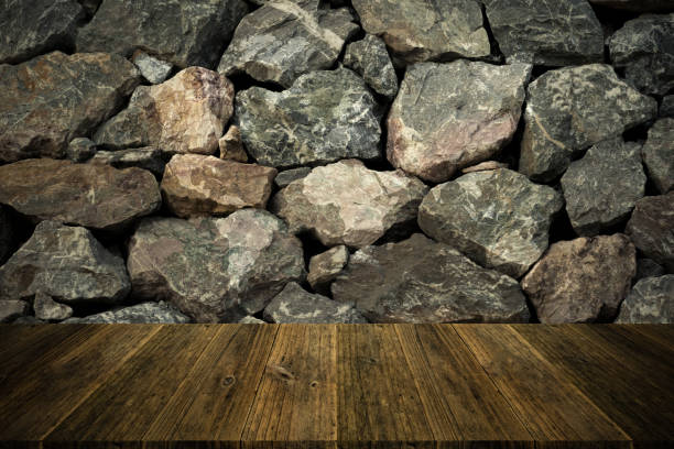 istock Stone wall texture background surface natural color with wood terrace with world map 824197534