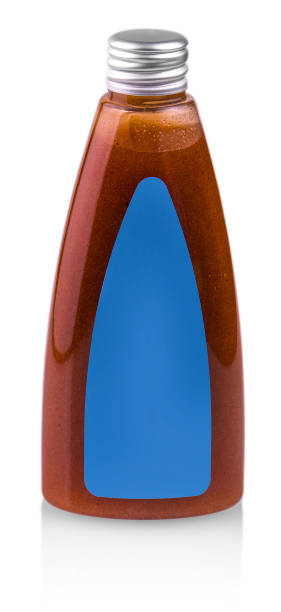 istock bottle with a female body scrub on white. 824204400