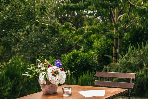 istock Black chairs wait for wedding guests on the green lawn 824204700