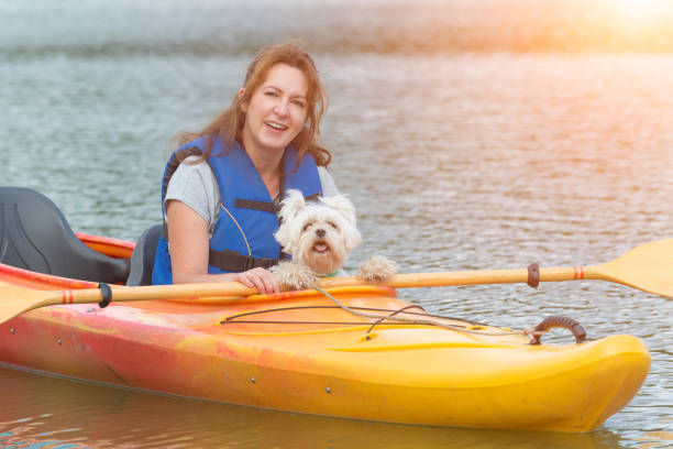 istock Woman and her dog on a kayak 824207342
