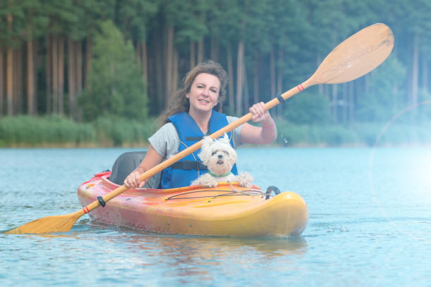 istock Woman and her dog on a kayak 824207380