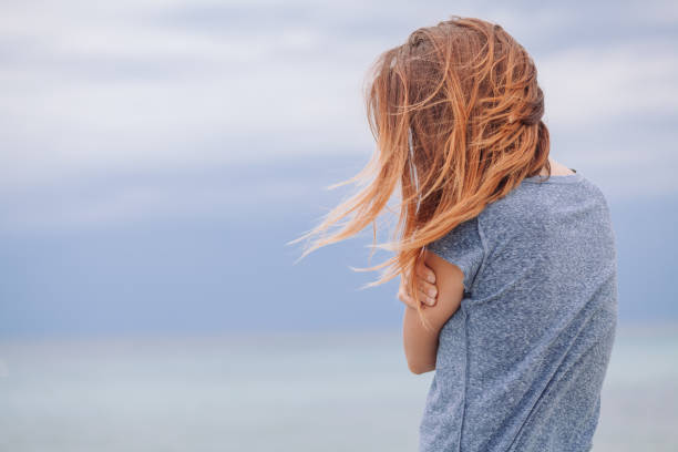 istock Woman alone and depressed at seaside 824208470