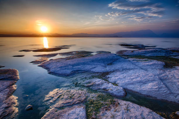 Garda lake during a vibrant colorful sunset, Sirmione, Italy