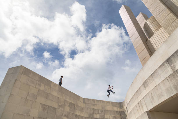 istock Young people playing with friends to enjoy Parkour 824213792