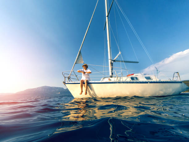 istock Woman enjoying her vacation on sailboat 824219506