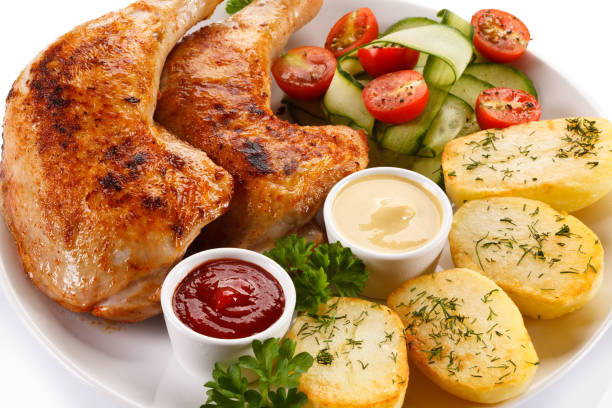 istock Roast chicken leg and vegetables 824219636