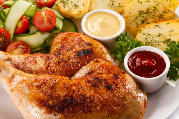 istock Roast chicken leg and vegetables 824219720