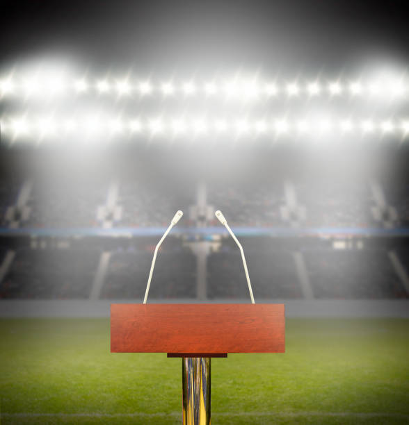 Prepared for the conference An empty podium and microphones at stadium with copy space. microphone stand photos stock pictures, royalty-free photos & images