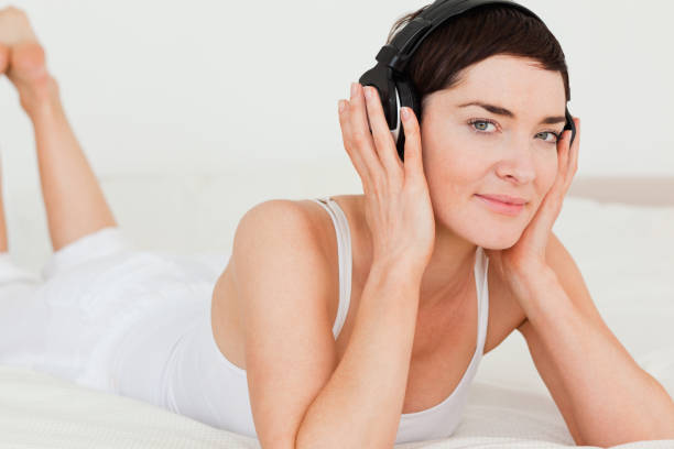 istock Young brunette listening to music 824223688