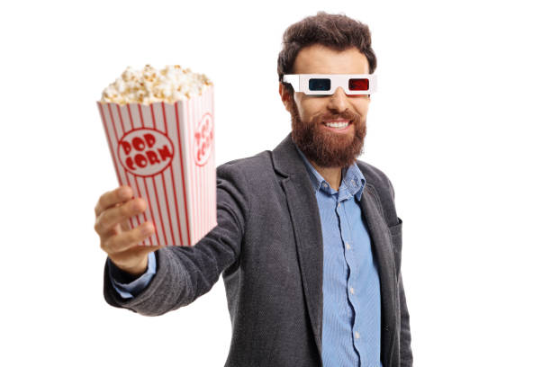 istock Bearded guy wearing 3D glasses and giving popcorn 824223890