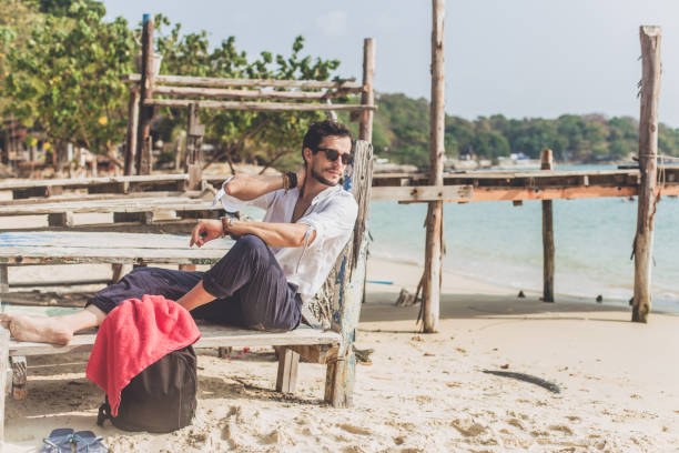 istock Carefree man relaxing at the beach 824226442