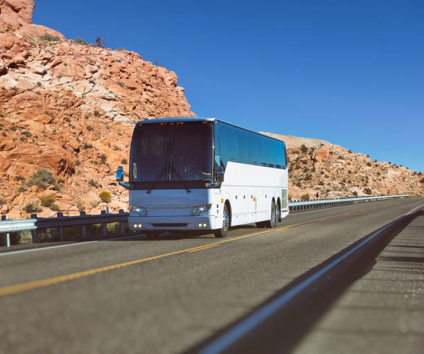 istock White long-distance bus driving through National Park USA 824231276