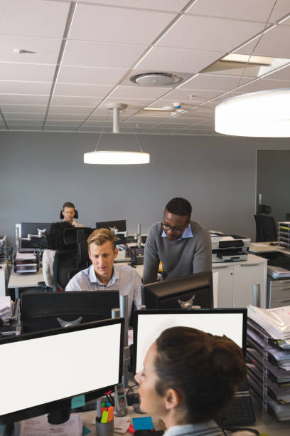 istock High angle view of business colleagues working in office 824238502