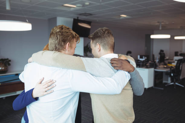 istock Business people huddling together 824242228
