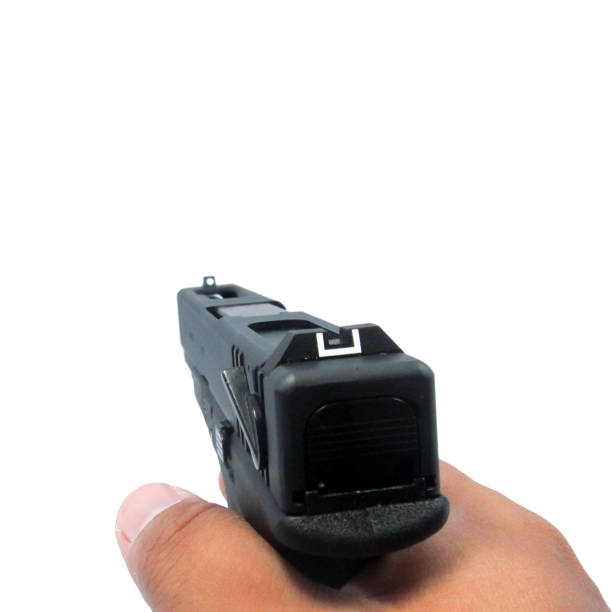 istock male hand with handgun isolated on white background ,clipping path in 824245100