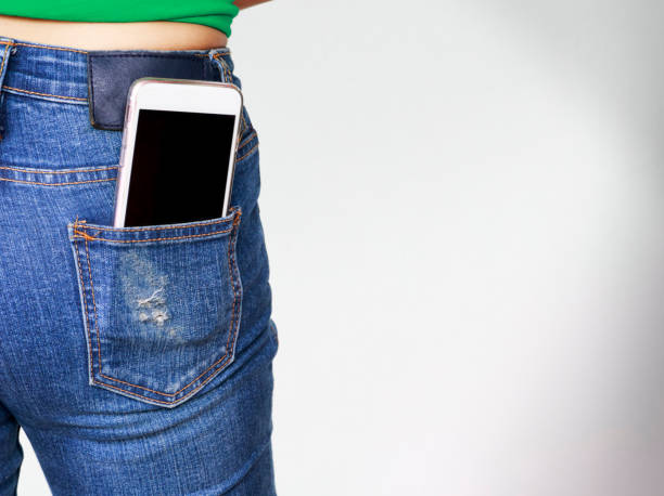 istock smartphone in the old jeans pocket 824246054