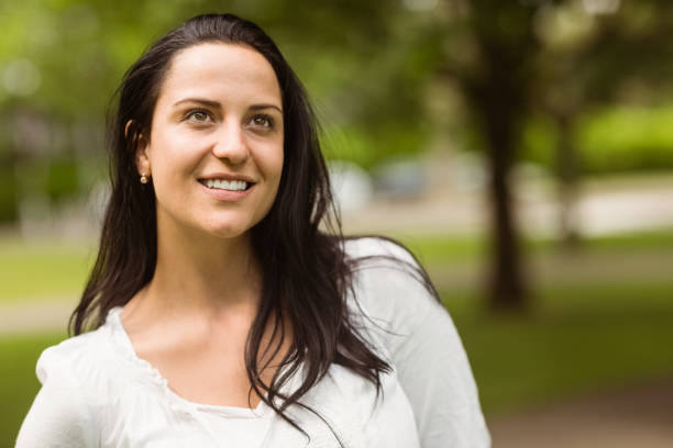 istock Portrait of a smiling brunette standing 824250372
