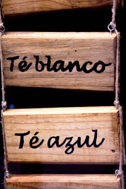istock Wooden poster with infusions written in spanish. White tea and blue tea. 824251438