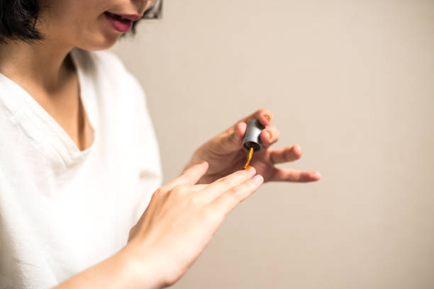 istock Woman painting nail polish 824254824