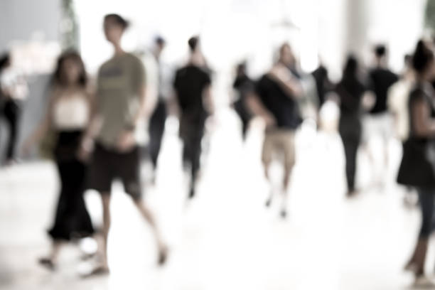 istock Abstract blur people walking in fashion mall 824258156
