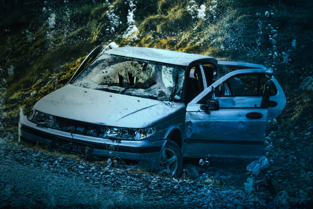 Crashed and sunken car stock photo