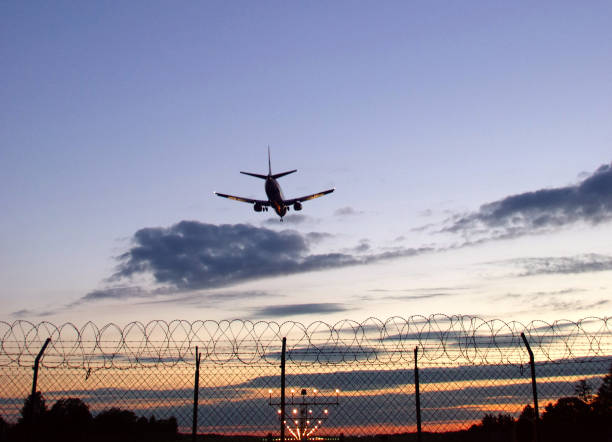 istock Silhouette of aircraft landing 824263182