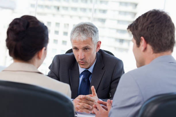 istock Entrepreneurs negotiating with their banker 824270094