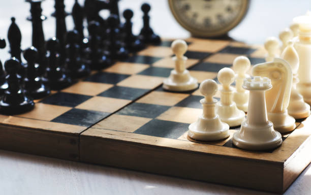istock White and black pieces on chess board 824273158