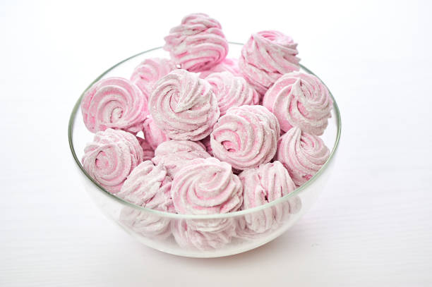 istock Served hand made zephyr from apples and raspberry on plate with cap of tea 824273544
