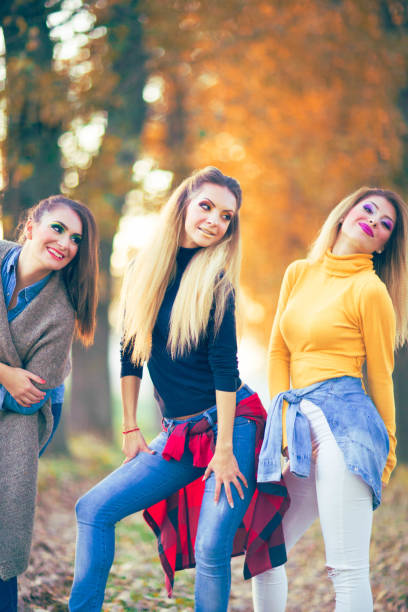 istock Beautiful girlfriends in park 824276826
