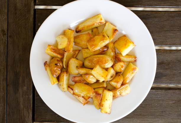 istock Plate of homemade potato chips from top view 824276914