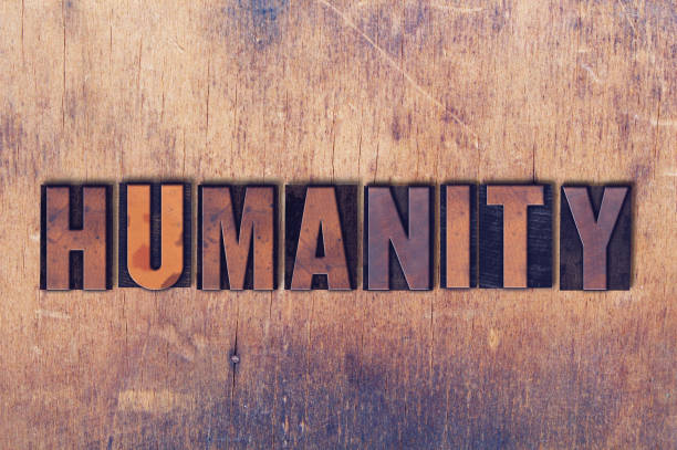 The word Humanity concept and theme written in vintage wooden letterpress type on a grunge background.