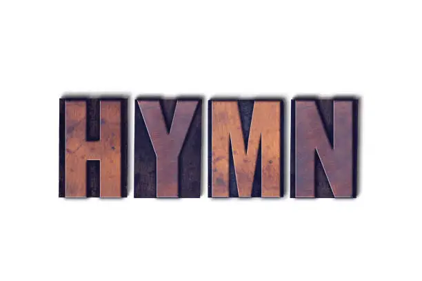 The word Hymn concept and theme written in vintage wooden letterpress type on a white background.