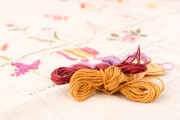 design della moda - cross stitch embroidery skeins thread foto e immagini stock