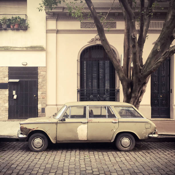 istock Deteriorated old car parked in the street 824298874