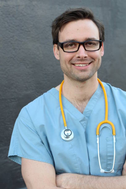 istock Caregiver isolated wearing scrubs and stethoscope 824312480