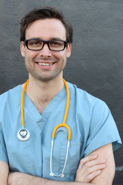 istock Empathetic doctor smiling close up 824316104