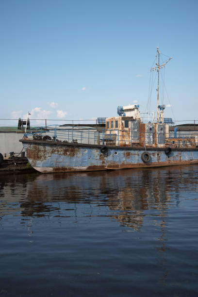 istock An old rusty ship in the pier on the Volga river. 824320758