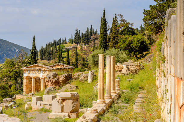 istock Athenian Treasury in Delphi, an archaeological site in Greece, at the Mount Parnassus. Delphi is famous by the oracle at the sanctuary dedicated to Apollo. UNESCO World heritage 824327526