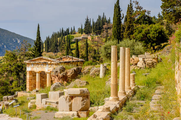istock Athenian Treasury in Delphi, an archaeological site in Greece, at the Mount Parnassus. Delphi is famous by the oracle at the sanctuary dedicated to Apollo. UNESCO World heritage 824327672