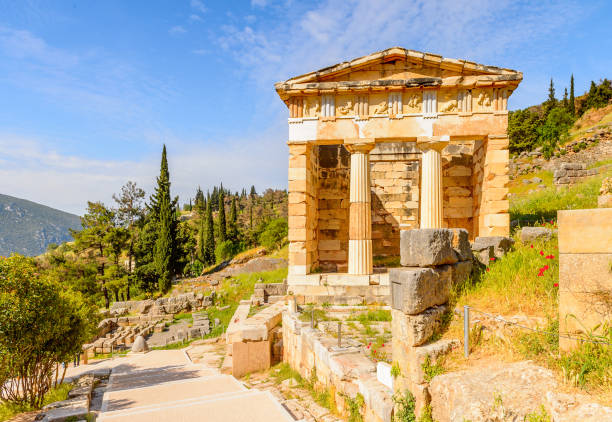 istock Athenian Treasury in Delphi, an archaeological site in Greece, at the Mount Parnassus. Delphi is famous by the oracle at the sanctuary dedicated to Apollo. UNESCO World heritage 824327702