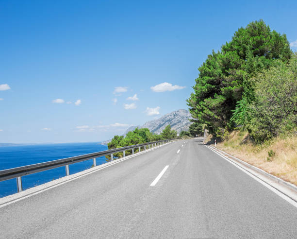 istock Asphalt road in a sunny day 824328108