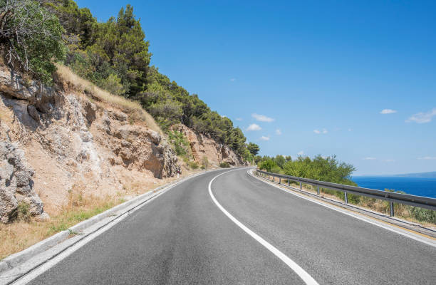 istock Asphalt road in a sunny day 824328154