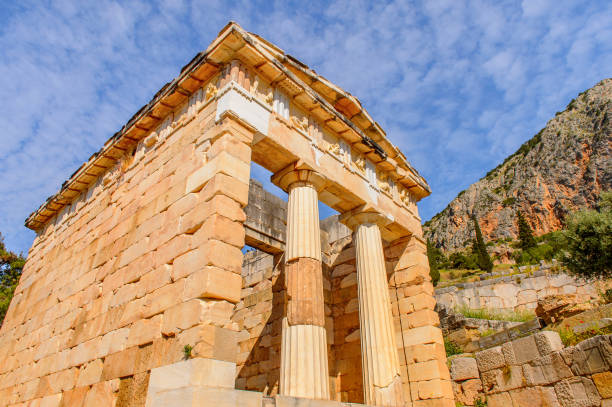 istock Athenian Treasury in Delphi, an archaeological site in Greece, at the Mount Parnassus. Delphi is famous by the oracle at the sanctuary dedicated to Apollo. UNESCO World heritage 824328376