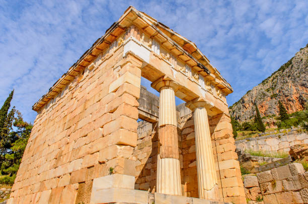 istock Athenian Treasury in Delphi, an archaeological site in Greece, at the Mount Parnassus. Delphi is famous by the oracle at the sanctuary dedicated to Apollo. UNESCO World heritage 824328408