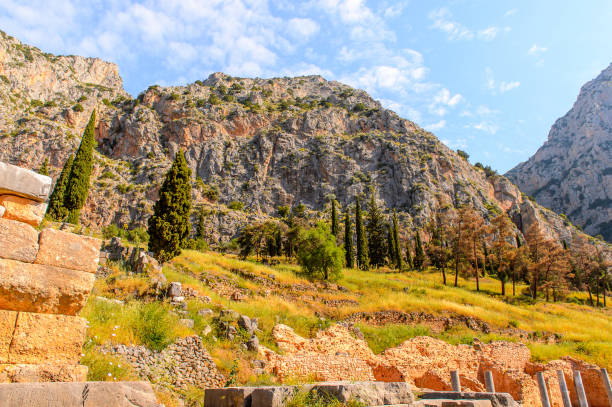 istock Ancient ruins of Delphi, an archaeological site in Greece, at the Mount Parnassus. Delphi is famous by the oracle at the sanctuary dedicated to Apollo. UNESCO World heritage 824328530