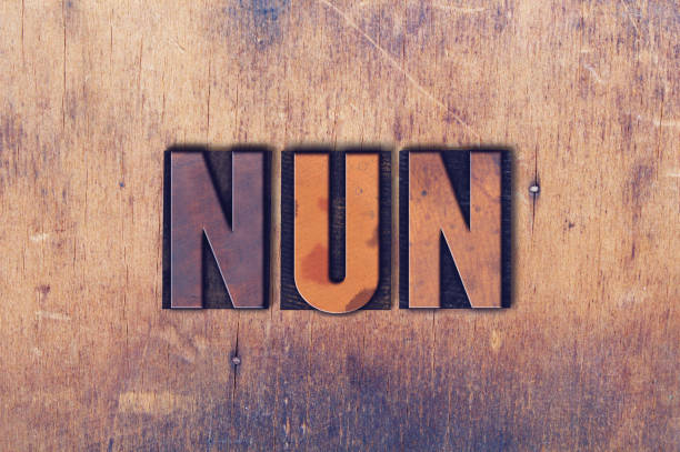 istock Nun Theme Letterpress Word on Wood Background 824333386